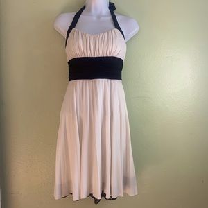 Off white with black halter pleated dress.